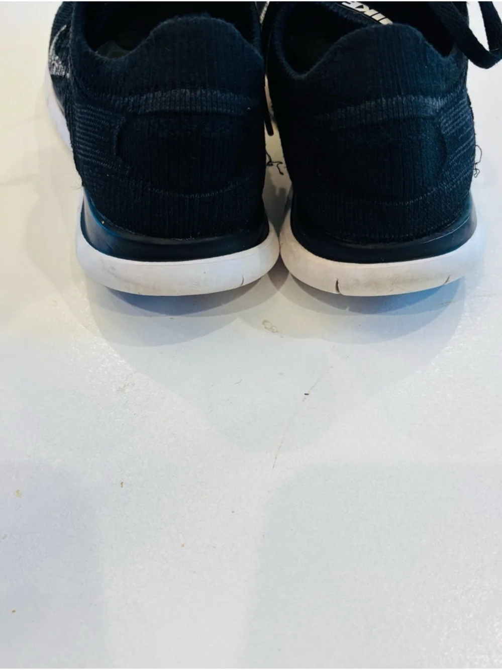 Nike Women’s Black Knit Sneakers with White Swoosh size 7.5